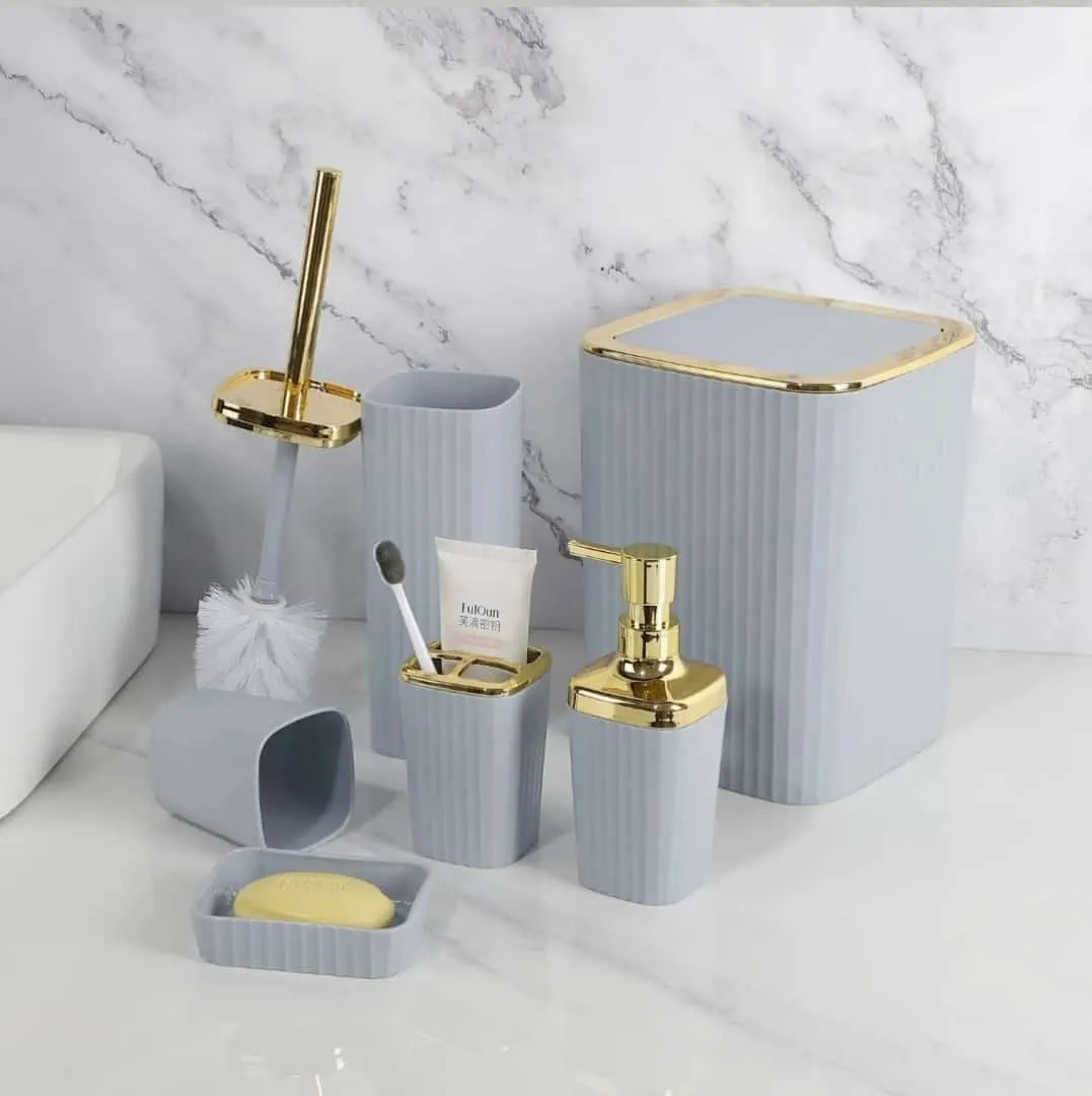 6 in 1 bathroom accessories set with gold ring.