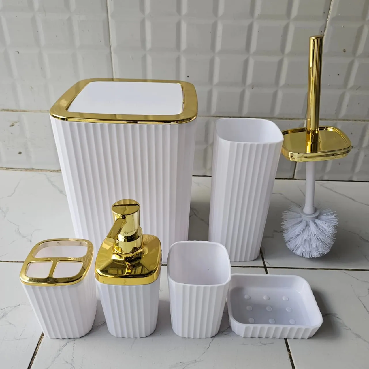 6 in 1 bathroom accessories set with gold ring.